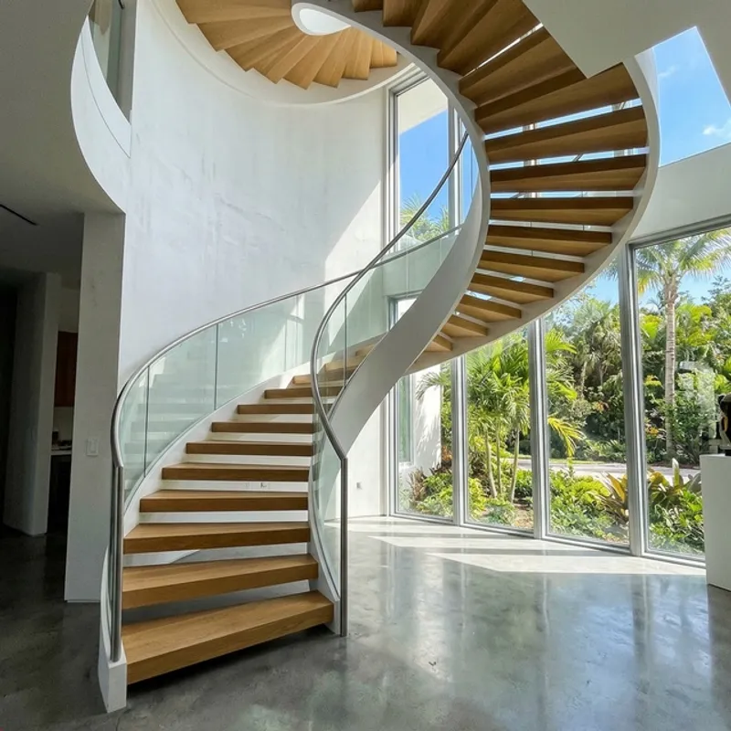 Curved cantilevered floating staircase in Houston home