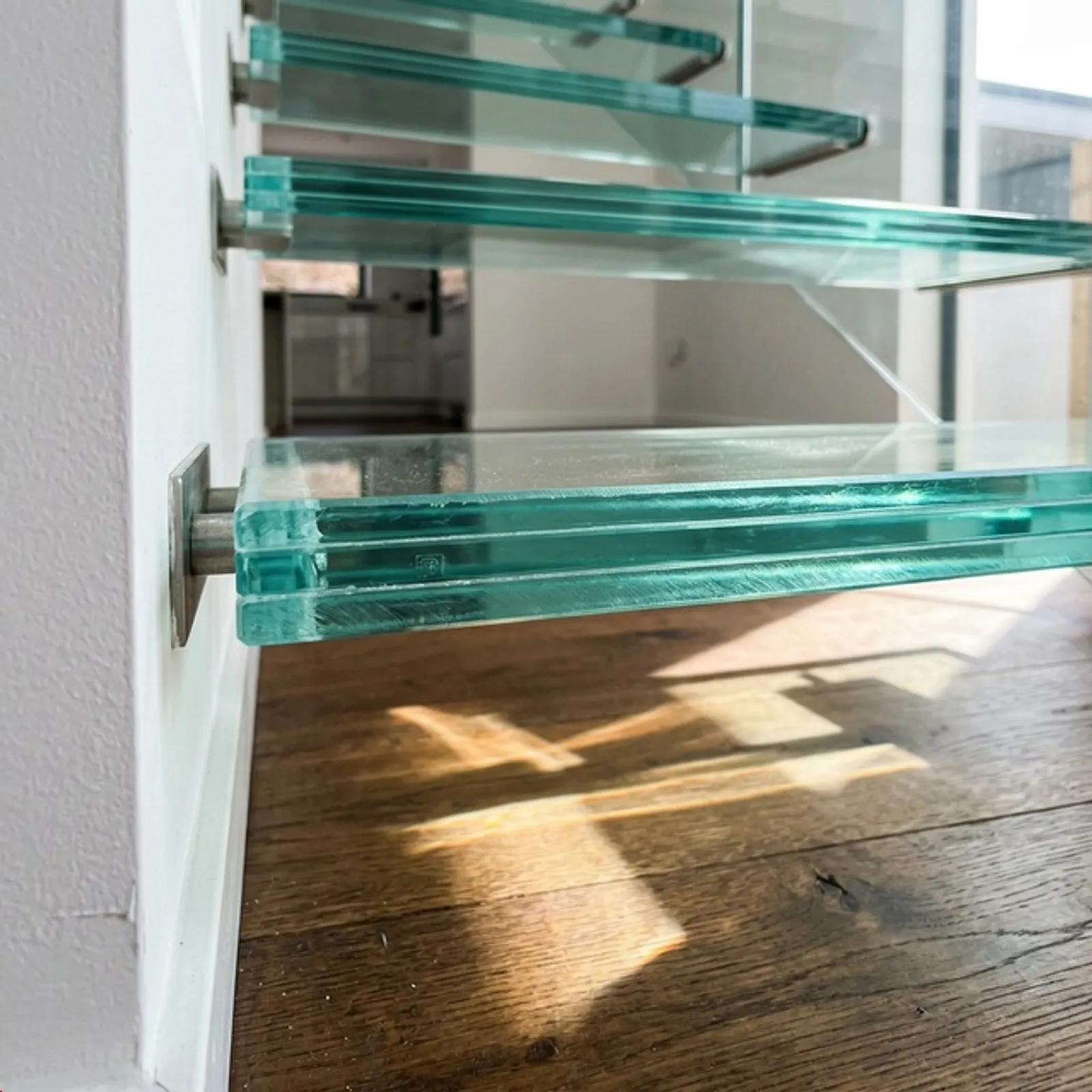 Glass tread cantilevered staircase with open sightlines in a Houston home